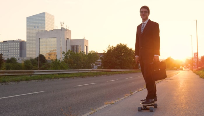Businessman on electric skateboard