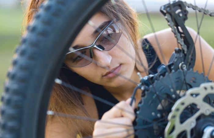 Girl repairing electric bike